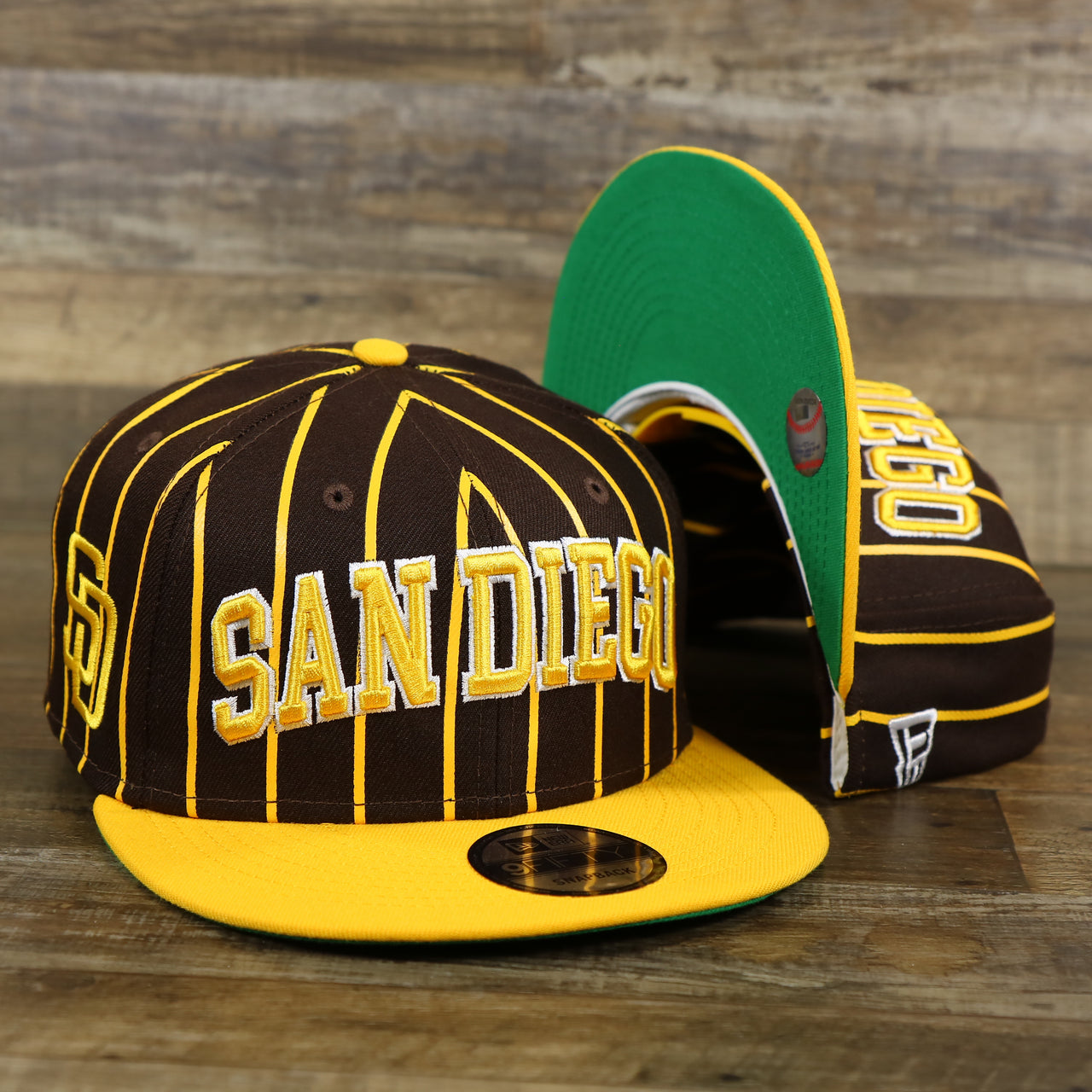The San Diego Padres City Arch Pinstriped 9Fifty Snapback Cap | Brown 9Fifty Cap