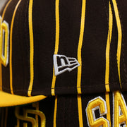 The New Era Logo on the San Diego Padres City Arch Pinstriped 9Fifty Snapback Cap | Brown 9Fifty Cap