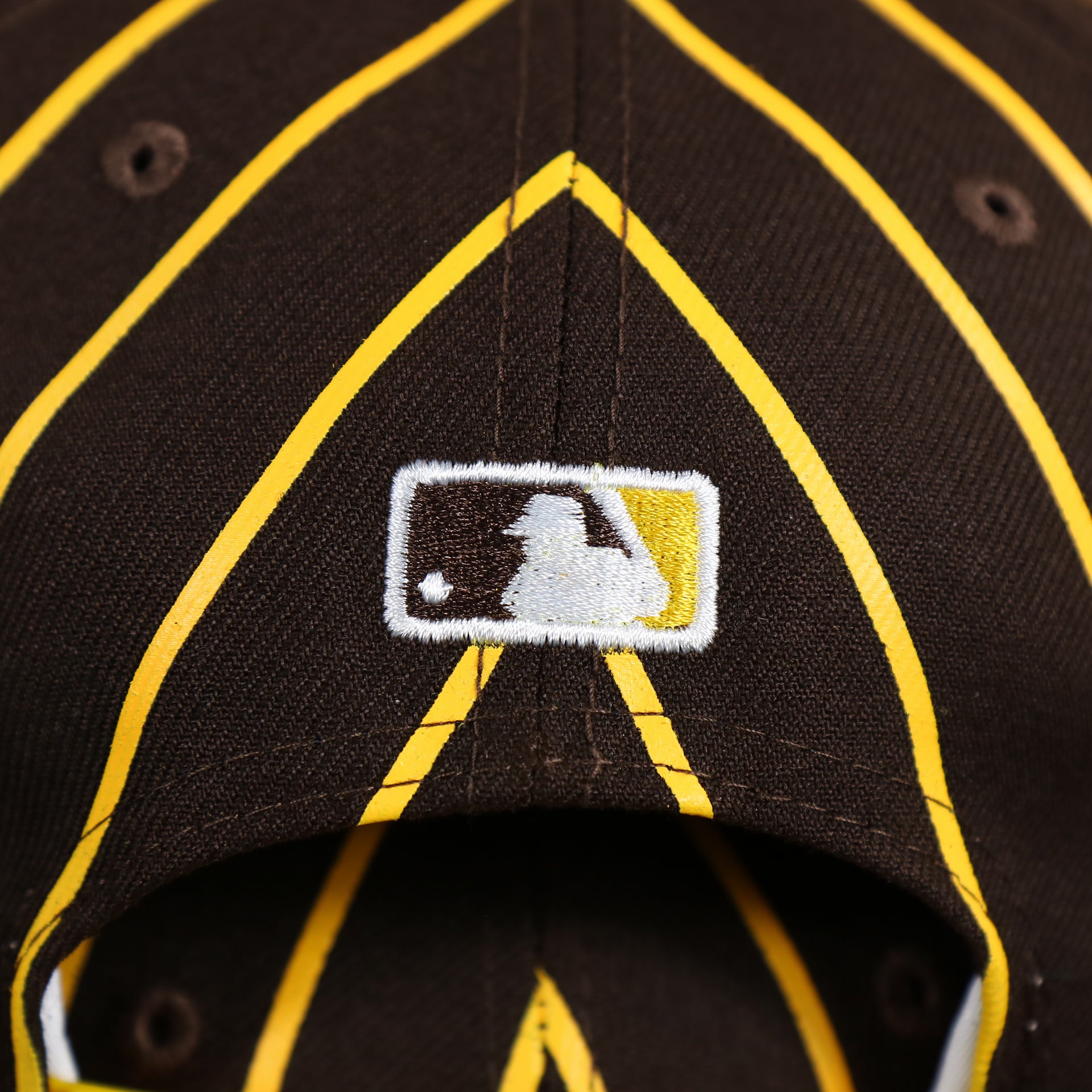 The MLB Batterman Logo Embroidered on the San Diego Padres City Arch Pinstriped 9Fifty Snapback Cap | Brown 9Fifty Cap