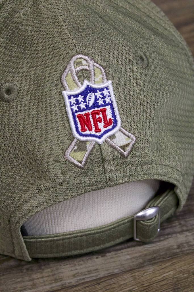 the NFL shield logo on the back of the New York Giants 2019 Salute to Service Dad Hat | Olive Green NFL On Field NY Giants Baseball Cap is made of raised embroidery over a camouflage ribbon