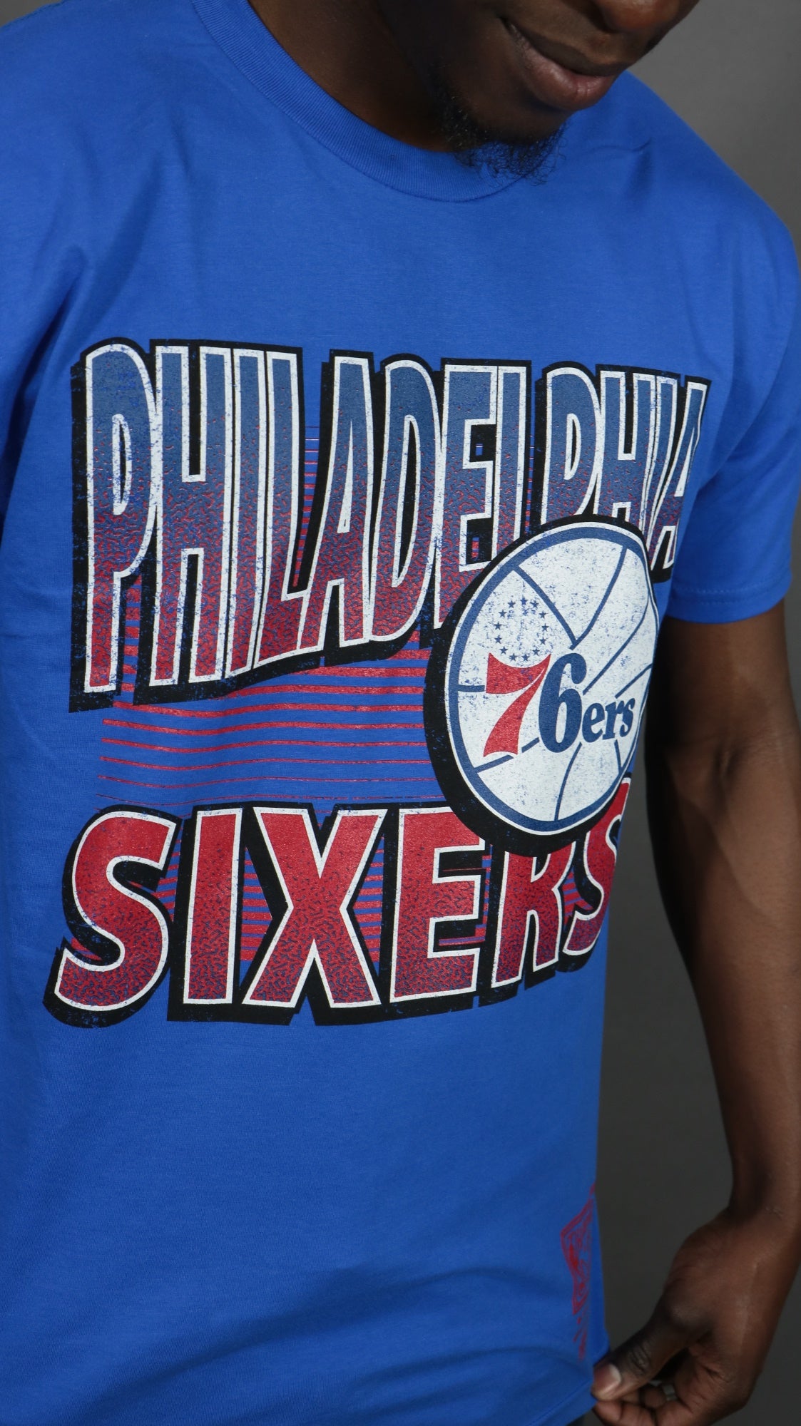 front of the Philadelphia 76ers NBA Hardwood Classics Incline Stacked Tee | Royal Blue T-shirt