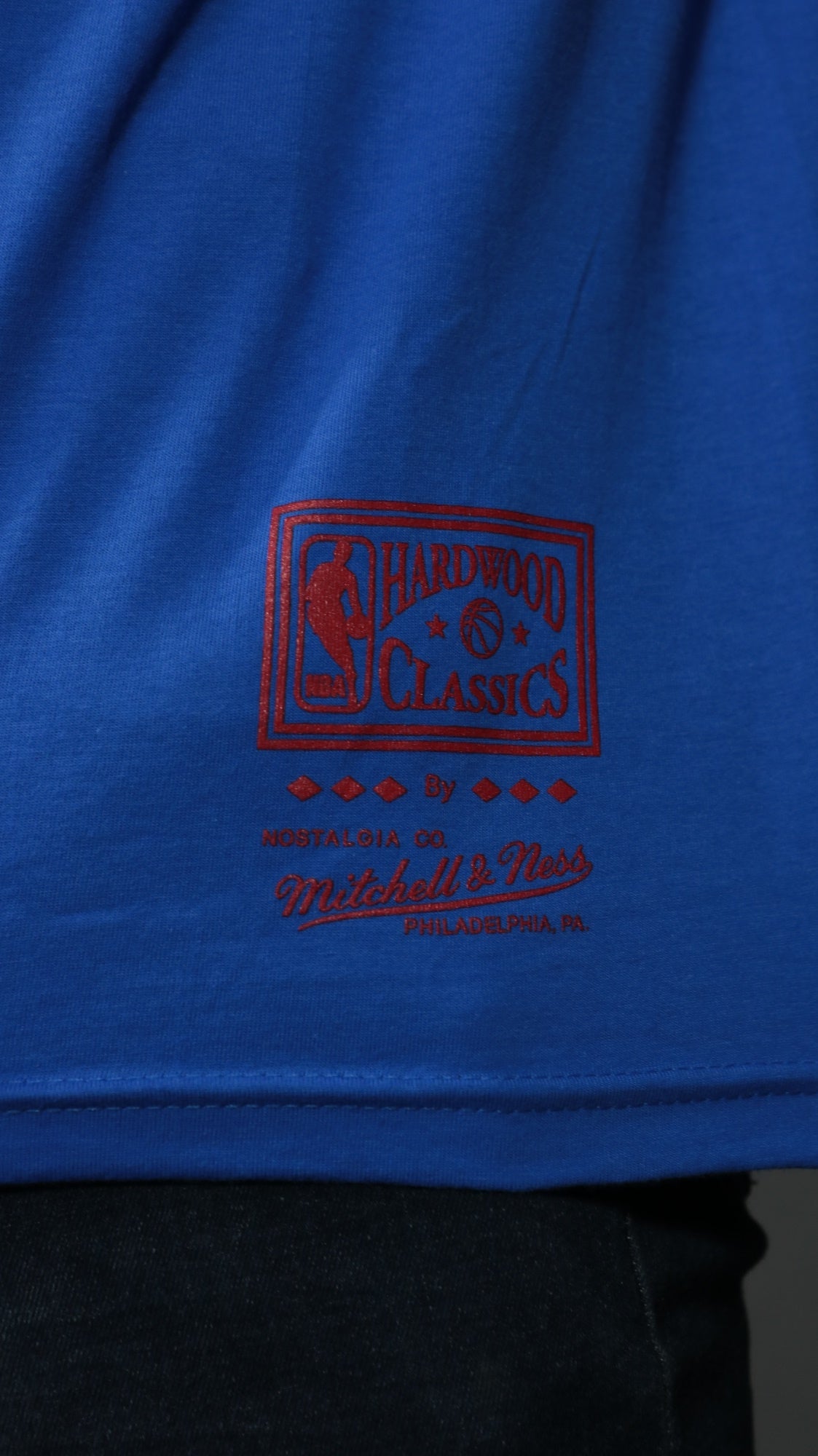 nba label on the Philadelphia 76ers NBA Hardwood Classics Incline Stacked Tee | Royal Blue T-shirt