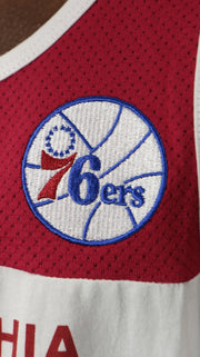 76ers logo on the Philadelphia 76ers Hardwood Classics "Sixers" Script | Red/White/Royal Cotton Tank