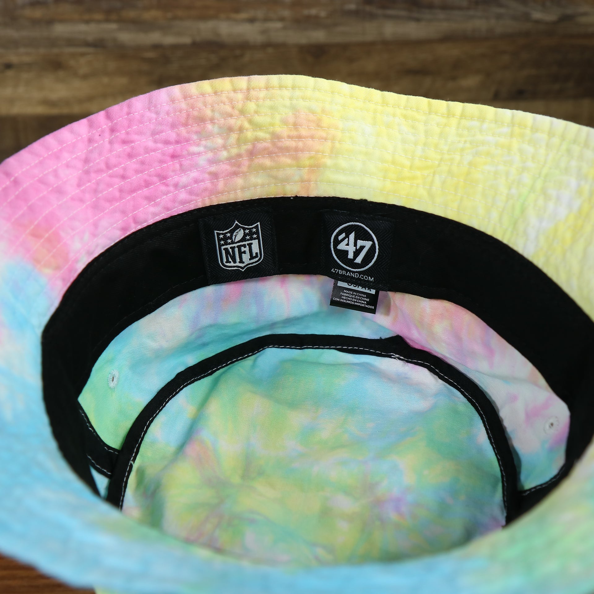 nfl and 47 brand label on the Philadelphia Eagles Tie Dye Bucket Hat