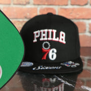 green under visor on the Philadelphia 76ers NBA Front Loaded "Sixers" script Green bottom Black Snapback Hat | Mitchell and Ness Snapback Cap