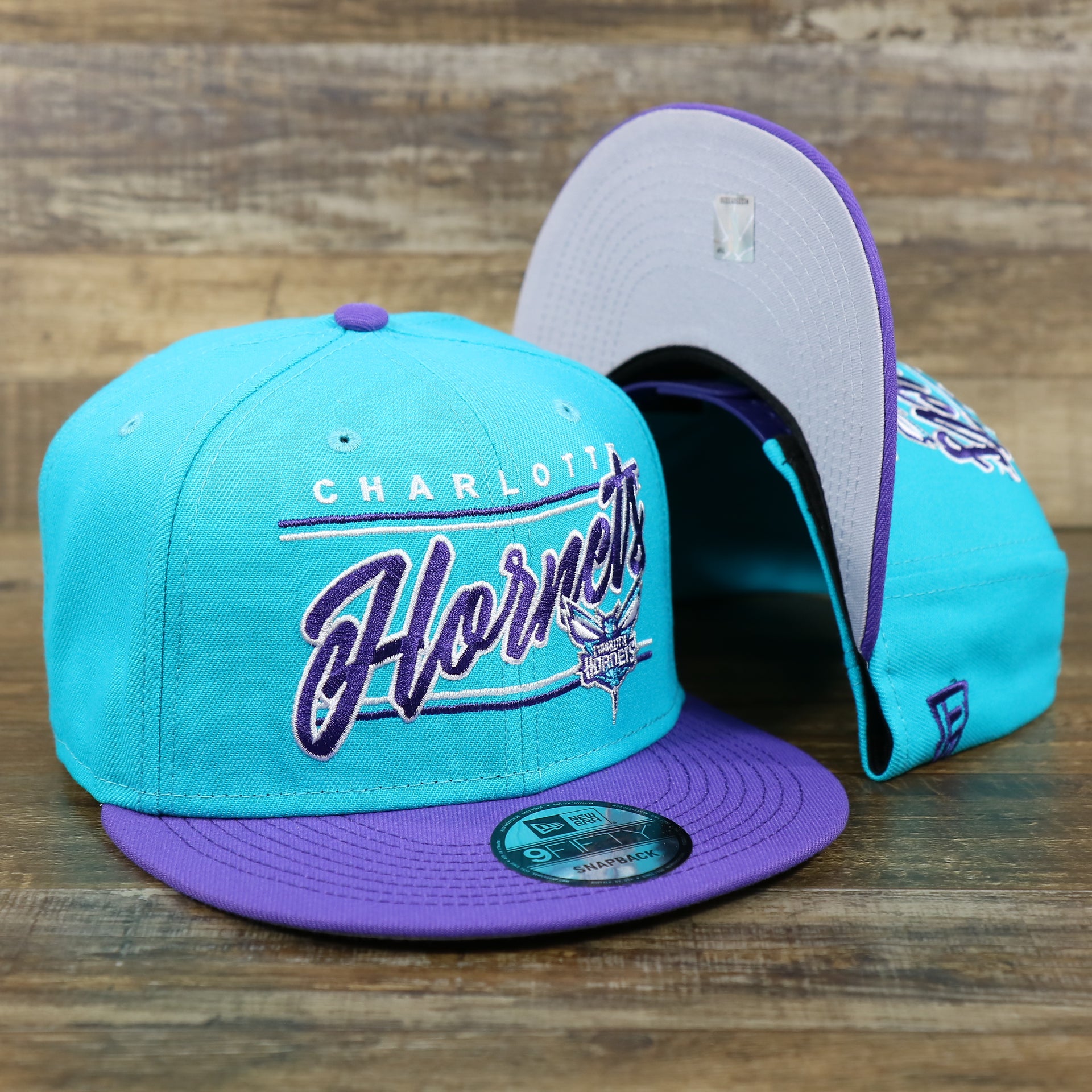 The Charlotte Hornets Team Script Gray Bottom 9Fifty Snapback | Turquoise and Purple Snap Cap