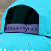 The Purple adjustable strap on the Charlotte Hornets Team Script Gray Bottom 9Fifty Snapback | Turquoise and Purple Snap Cap