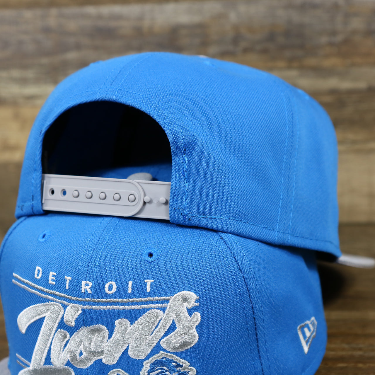 The Backside on the Detroit Lions Team Script Gray Bottom 9Fifty Snapback | Blue and Gray Snap Cap