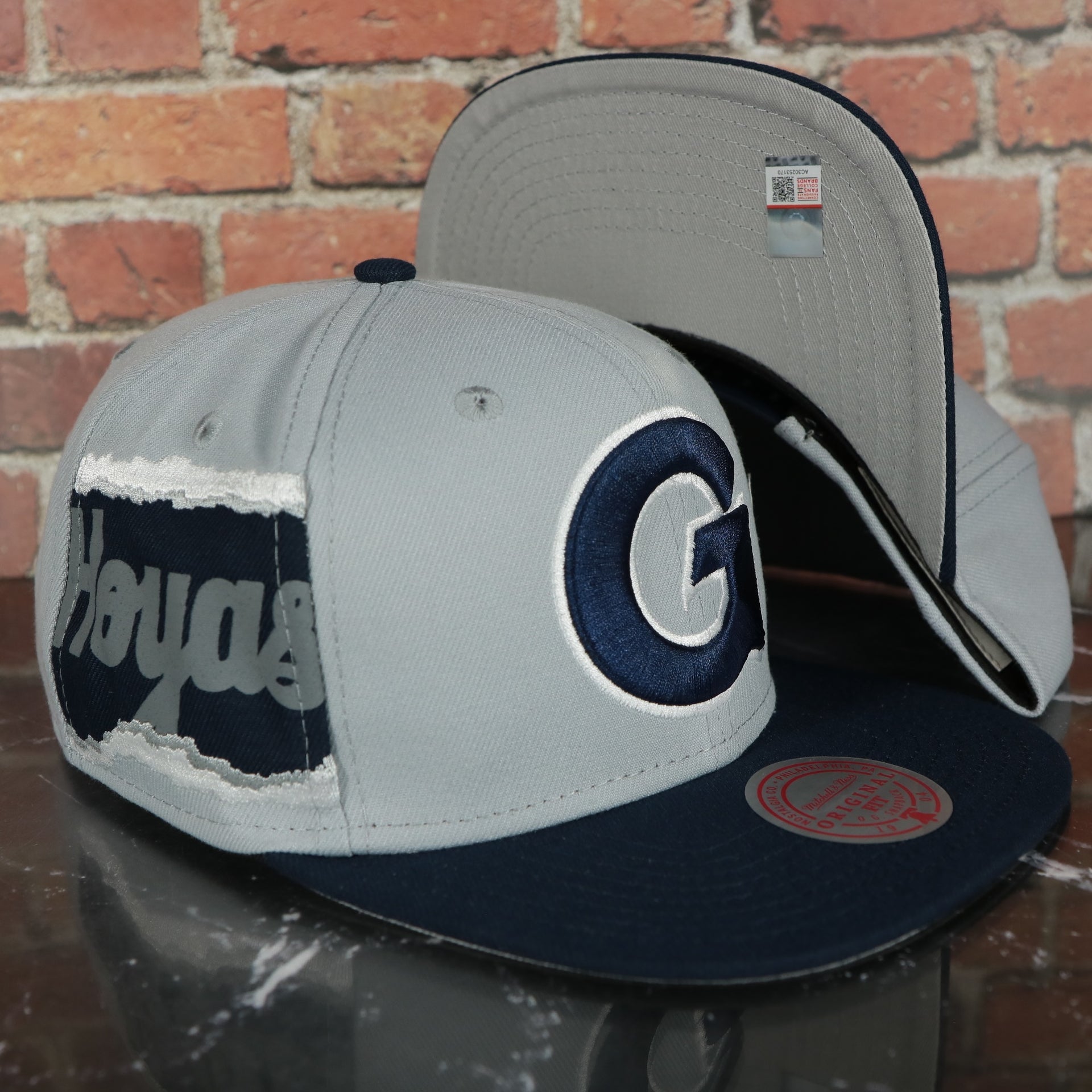 Georgetown Hoyas NCAA Jumbotron "Hoyas" Ripped Wordmark side patch Grey Bottom Grey/Navy Snapback hat | Mitchell and Ness Two Tone Snap Cap