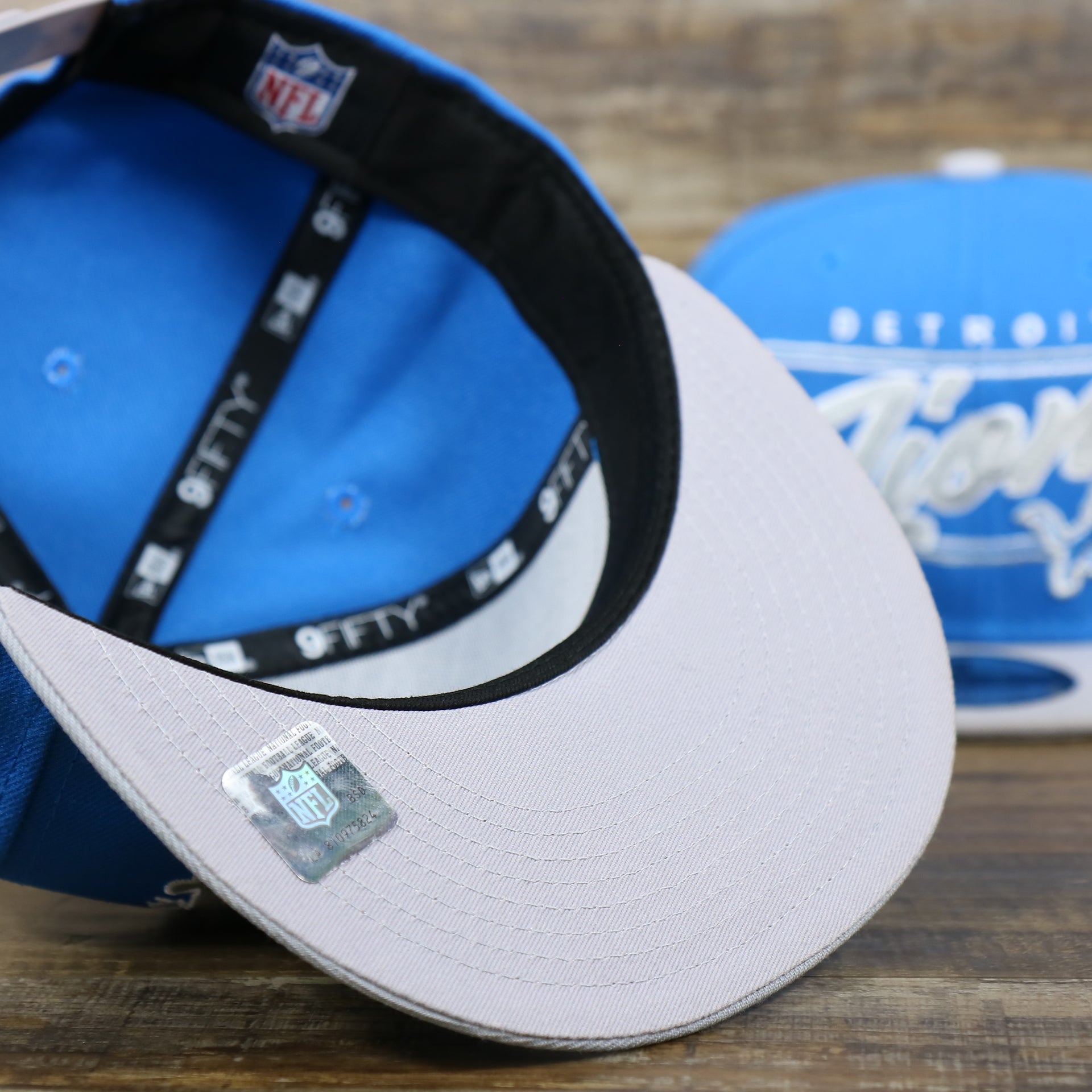 The Gray undervisor on the Detroit Lions Team Script Gray Bottom 9Fifty Snapback | Blue and Gray Snap Cap