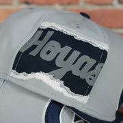 hoyas jumbotron side patch on the Georgetown Hoyas NCAA Jumbotron "Hoyas" Ripped Wordmark side patch Grey Bottom Grey/Navy Snapback hat | Mitchell and Ness Two Tone Snap Cap