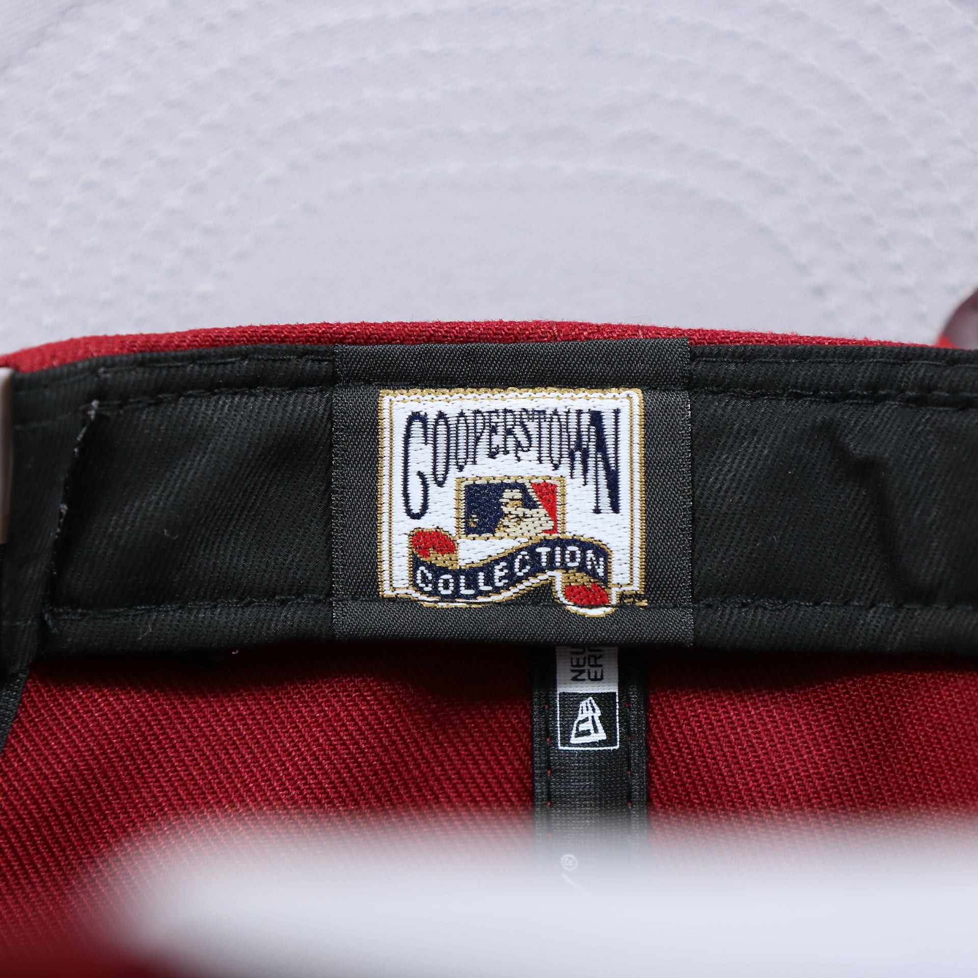 The Cooperstown Tag on the Philadelphia Phillies Team Script Gray Bottom 9Fifty Snapback | Maroon And Grey Snap Cap