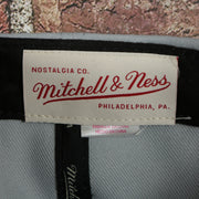mitchell and ness label on the Georgetown Hoyas NCAA Jumbotron "Hoyas" Ripped Wordmark side patch Grey Bottom Grey/Navy Snapback hat | Mitchell and Ness Two Tone Snap Cap