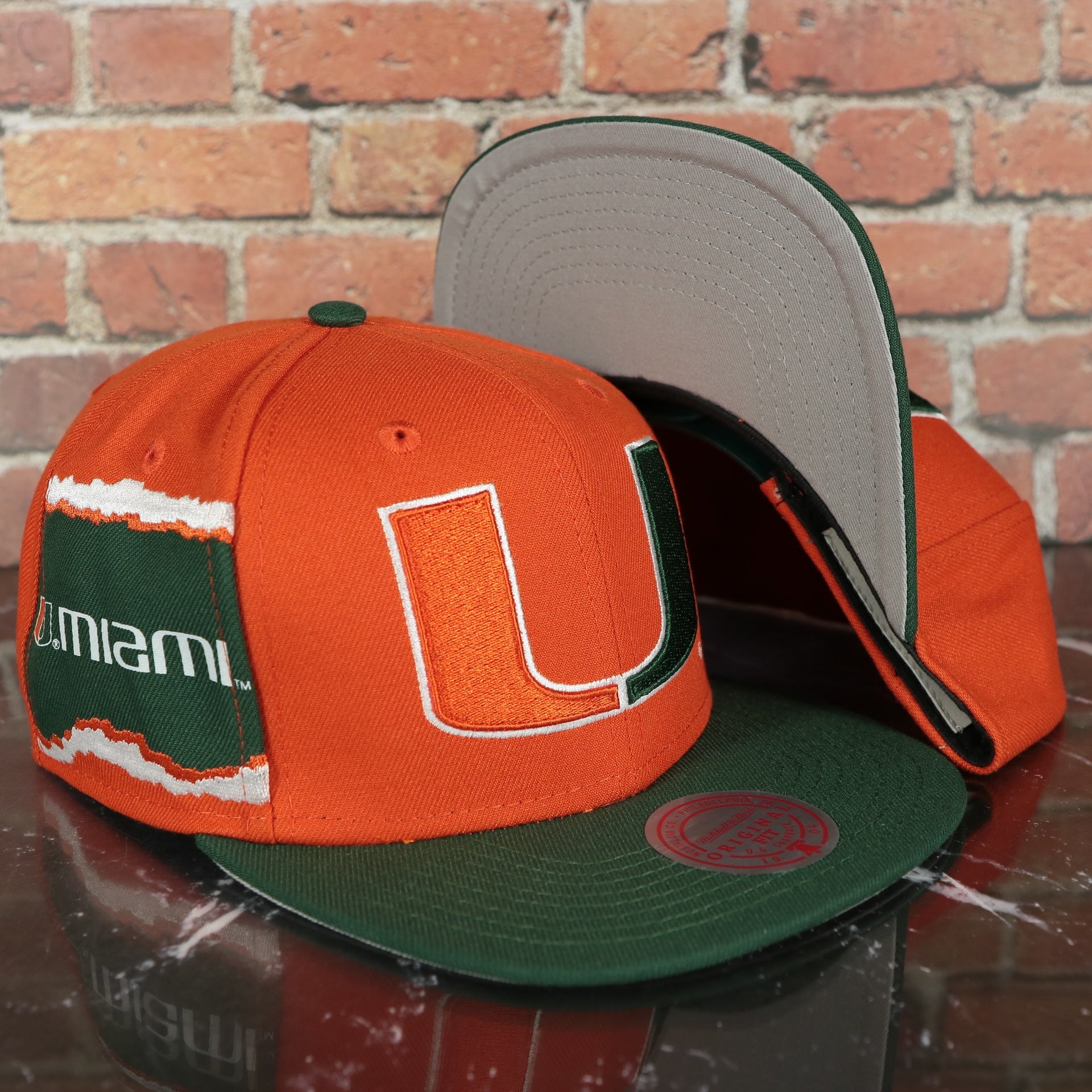 Miami Hurricanes NCAA Jumbotron "U Miami" Ripped Wordmark side patch Grey Bottom Orange/Green Snapback hat | Mitchell and Ness Two Tone Snap Cap