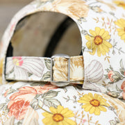 Close up of the metallic buckle on the adjustable strap on the back of the New York Yankees All Over Sunflower Rose Floral Fall Flower Bloom Print Ladies' Ball Cap