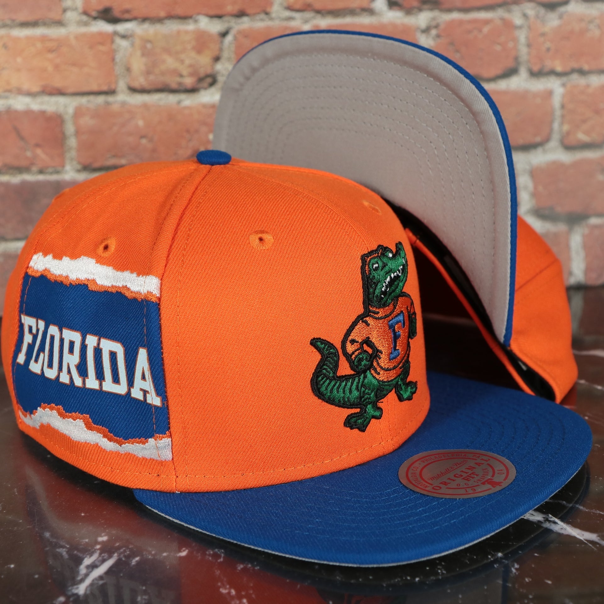 Florida Gators NCAA Jumbotron "Florida" Ripped Wordmark side patch Grey Bottom Yellow/Navy Snapback hat | Mitchell and Ness Two Tone Snap Cap
