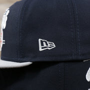 Close up of the New Era logo on the New York Yankees "Team Script" College Bar Style 9Fifty Snapback Hat | Vintage Logo, Navy/Grey