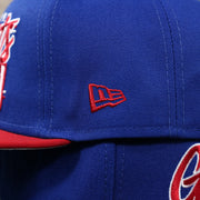 The New Era logo on the New York Giants Team Script Gray Bottom 9Fifty Snapback | Royal Blue And Red Snap Cap