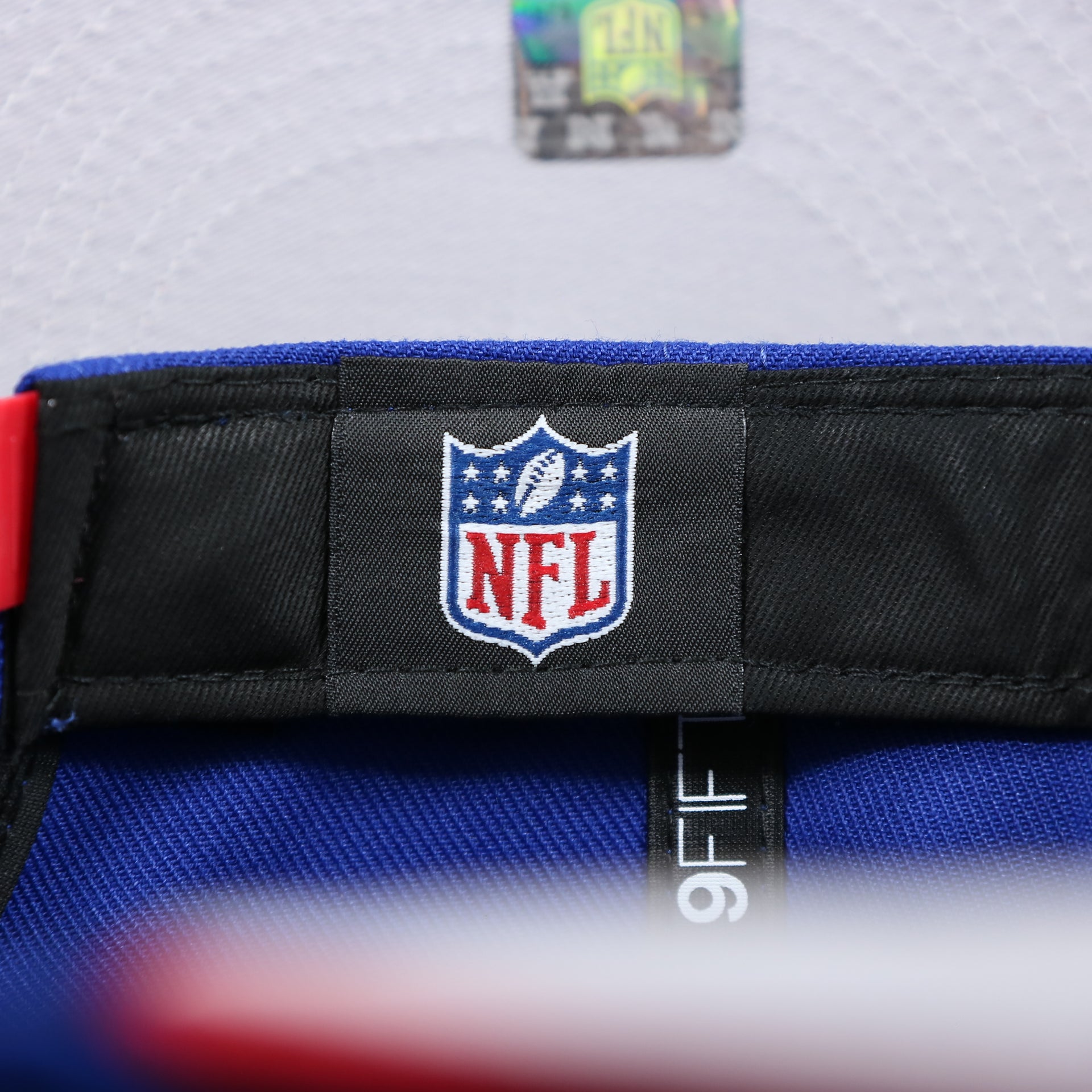 The NFL Tag on the New York Giants Team Script Gray Bottom 9Fifty Snapback | Royal Blue And Red Snap Cap