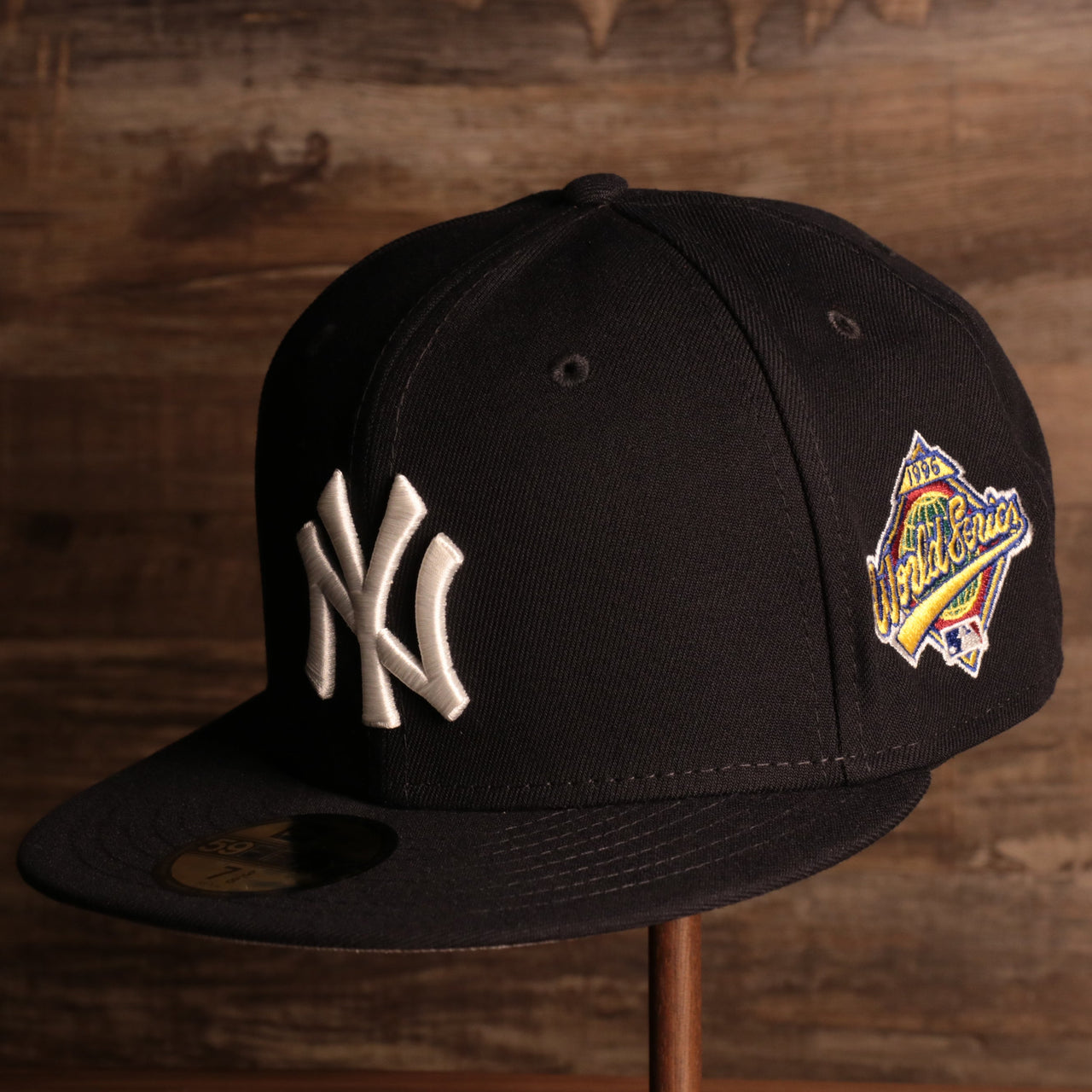 Yankees On-Field Grey Bottom Fitted Cap | New York Yankees 1996 Game Worn World Series Side Patch Gray Under Brim 59Fifty Fitted Hat the front of this yankees fitted cap has the yankees logo with the 1996 world series patch on the side
