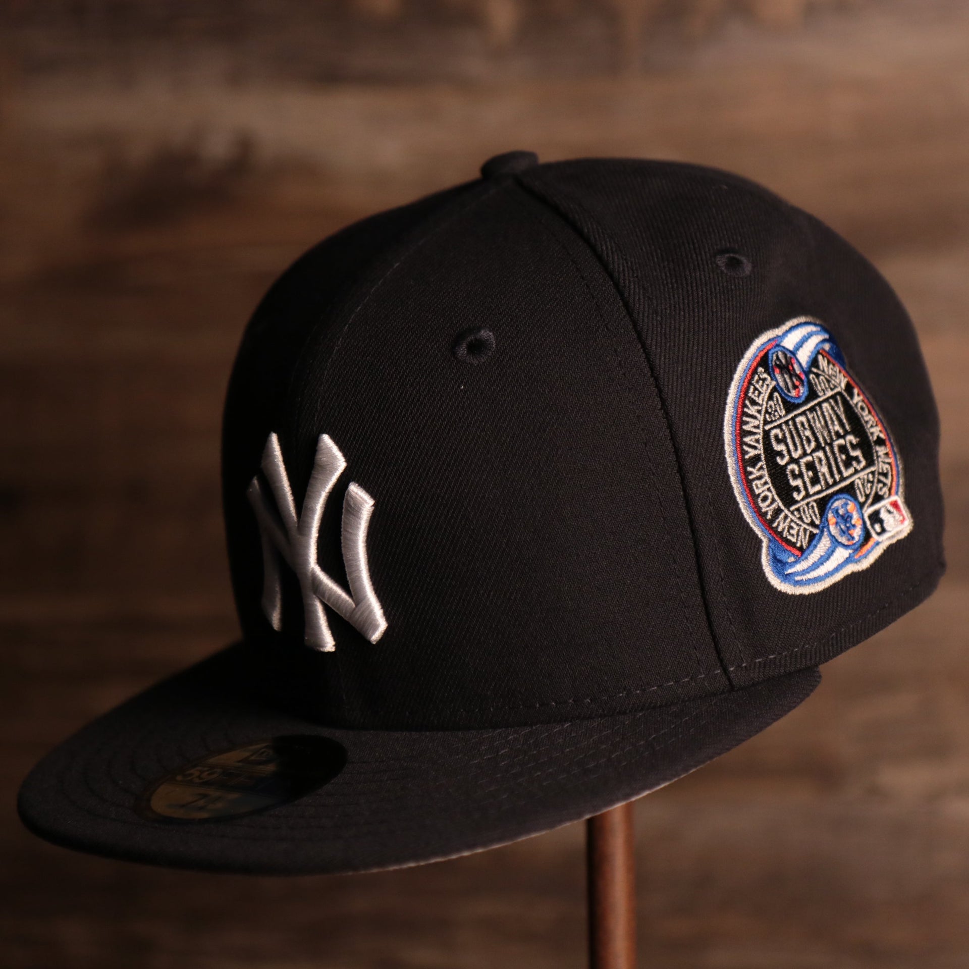 Yankees On-Field Grey Bottom Fitted Cap | New York Yankees 2000 Game Worn Subway Series Side Patch Gray Under Brim 59Fifty Fitted Hat the front of this fitted cap has the yankees logo with the subway series logo on the side