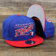 The Philadelphia 76ers Team Script Gray Bottom 9Fifty Snapback | Royal Blue And Red Snap Cap