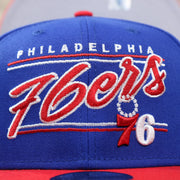 The 76ers Team Script on the Philadelphia 76ers Team Script Gray Bottom 9Fifty Snapback | Royal Blue And Red Snap Cap
