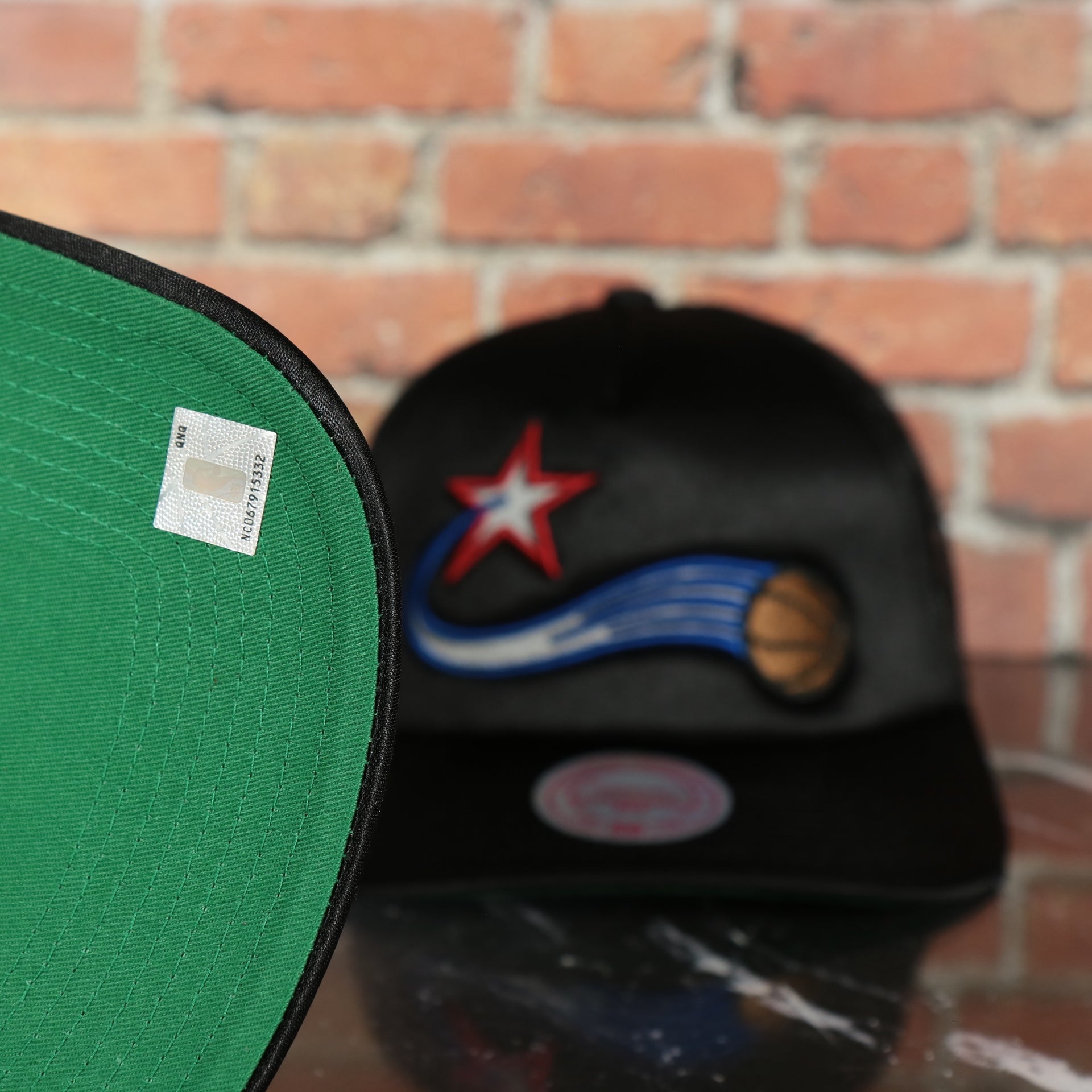 green under visor on the Philadelphia 76ers NBA Logo Remix 1997 Sixers Retro side patch Green bottom Black Trucker Hat | Mitchell and Ness Snap cap
