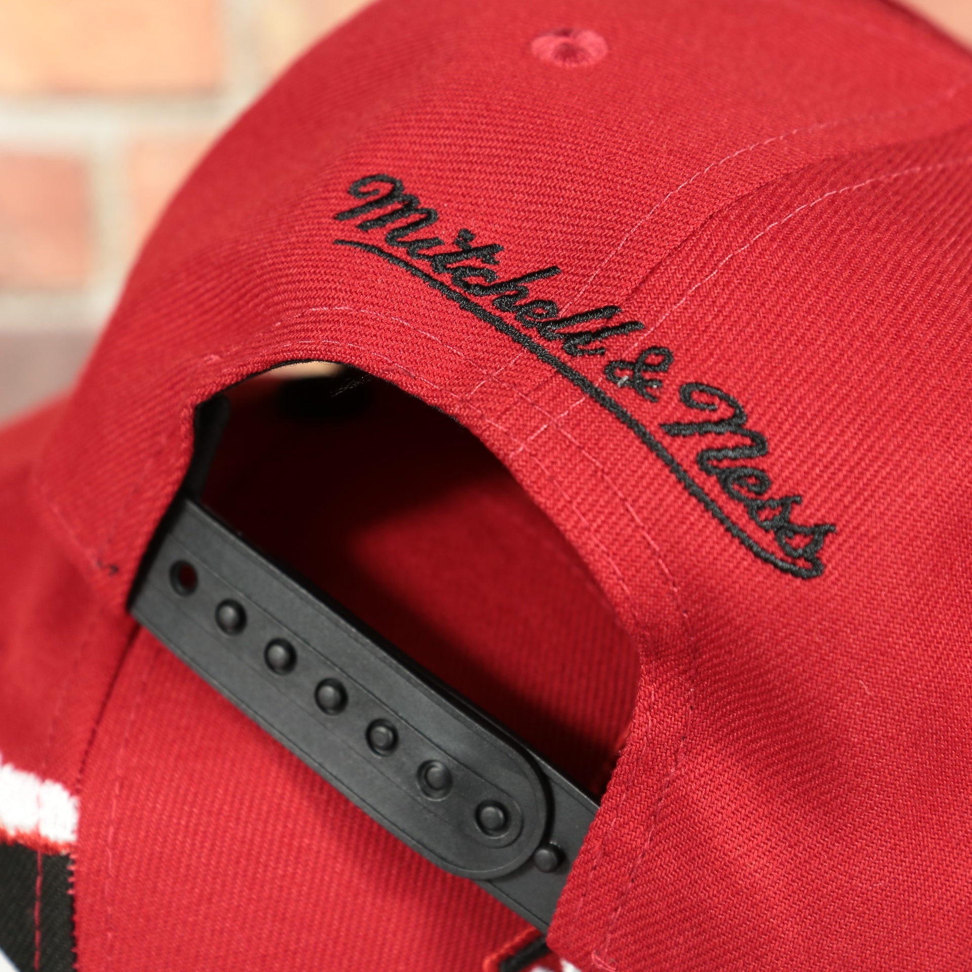 mitchell and ness logo on the Ohio State Buckeyes NCAA Jumbotron "Ohio State" Ripped Wordmark side patch Grey Bottom Red/Black Snapback hat | Mitchell and Ness Two Tone Snap Cap