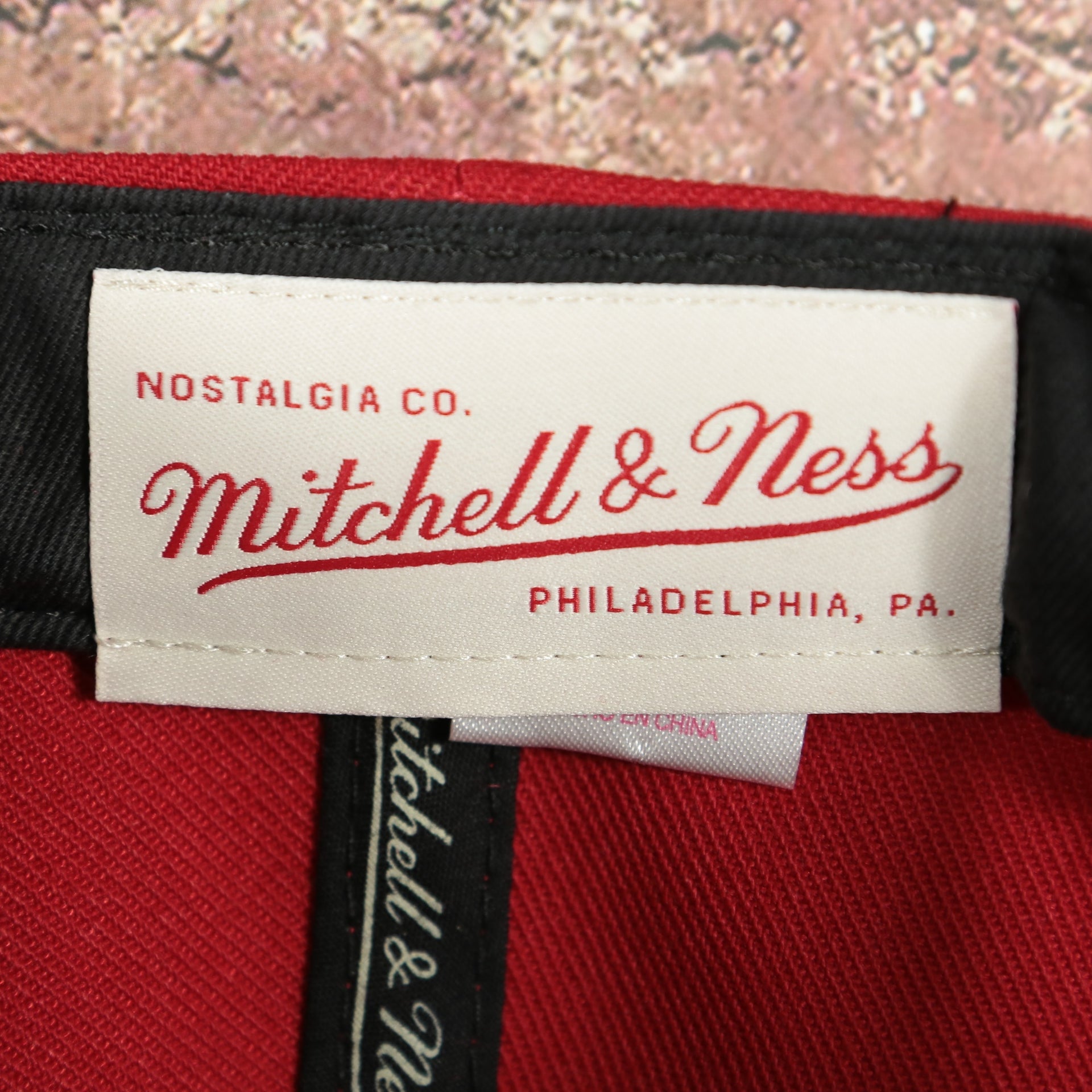 mitchell and ness label on the Ohio State Buckeyes NCAA Jumbotron "Ohio State" Ripped Wordmark side patch Grey Bottom Red/Black Snapback hat | Mitchell and Ness Two Tone Snap Cap