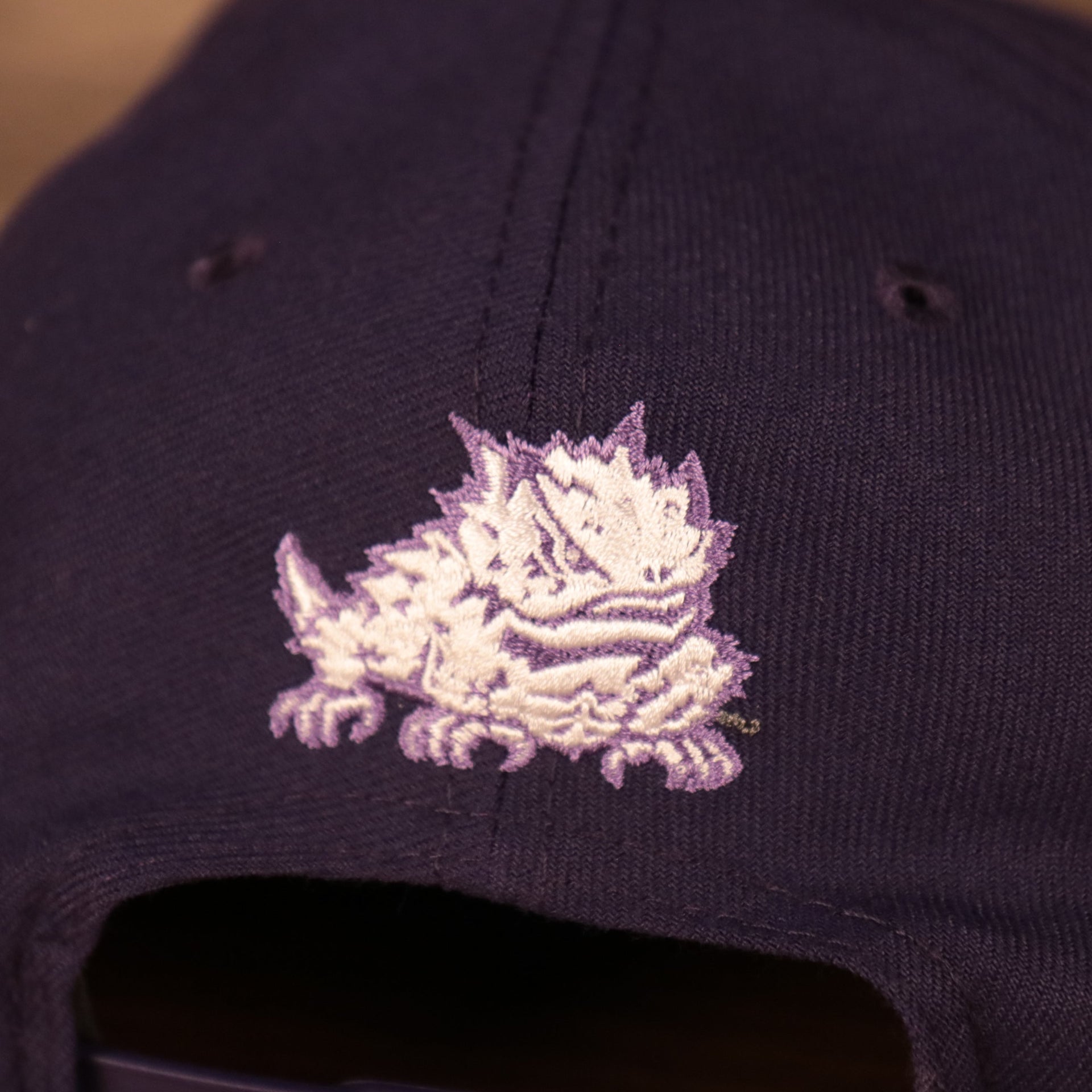 horned frog logo on the back of the TCU Horned Frogs Purple Adjustable Snapback Cap