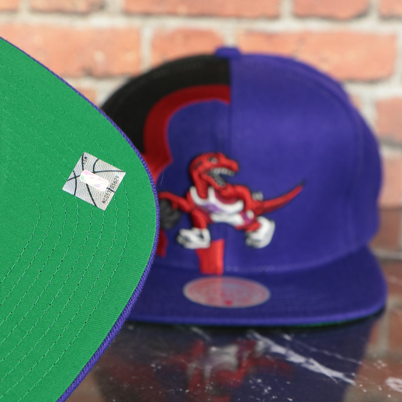 green under visor on the Toronto Raptors Retroline Logo Outline Vintage Snapback Hat | Mitchell and Ness Raptors Snap Cap
