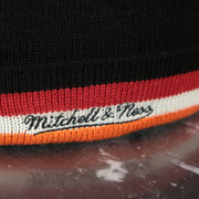 mitchell and ness logo on the Miami Heat Colorway Cuffed Pom Pom Winter Beanie | Black Winter Beanie