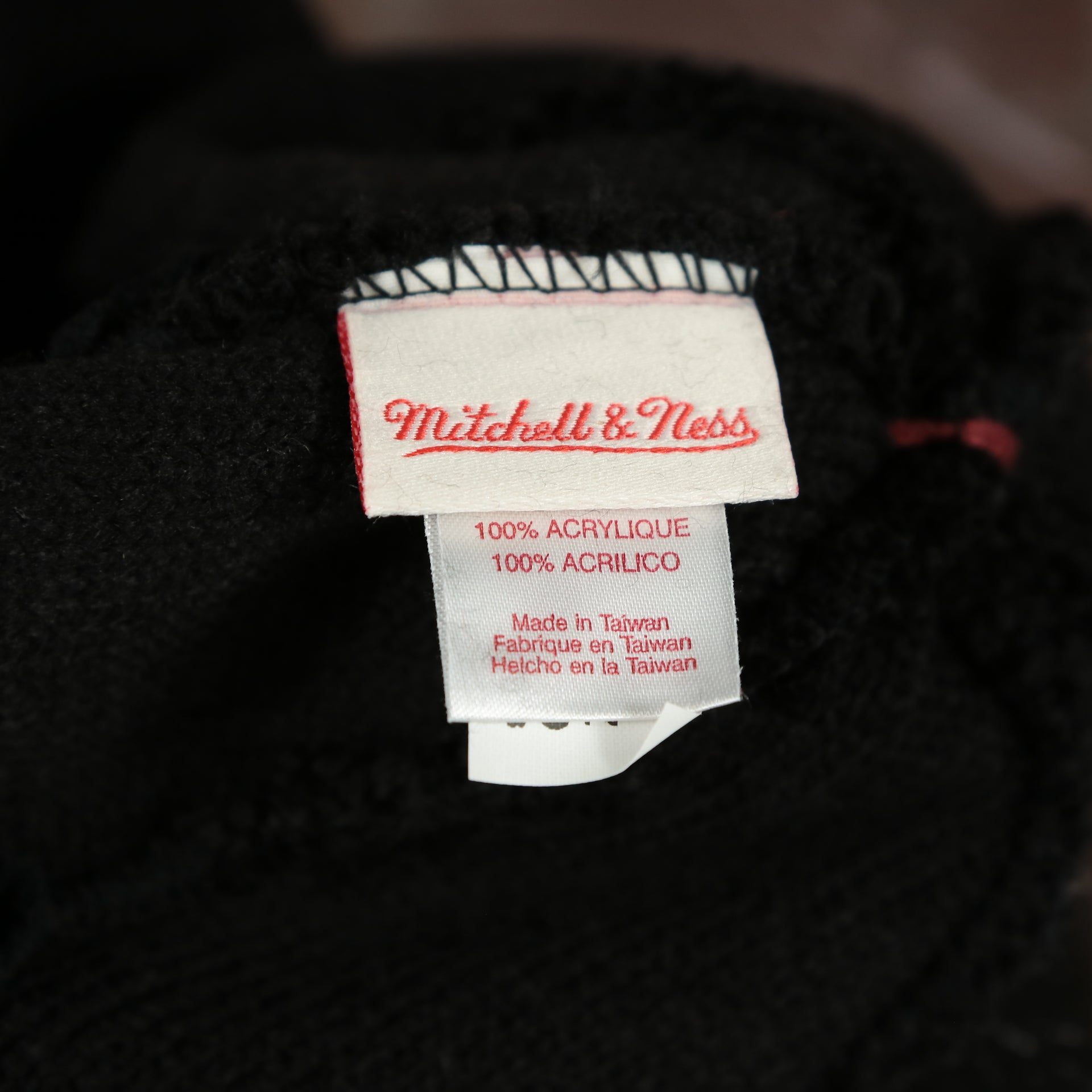 mitchell and ness label on the Miami Heat Colorway Cuffed Pom Pom Winter Beanie | Black Winter Beanie