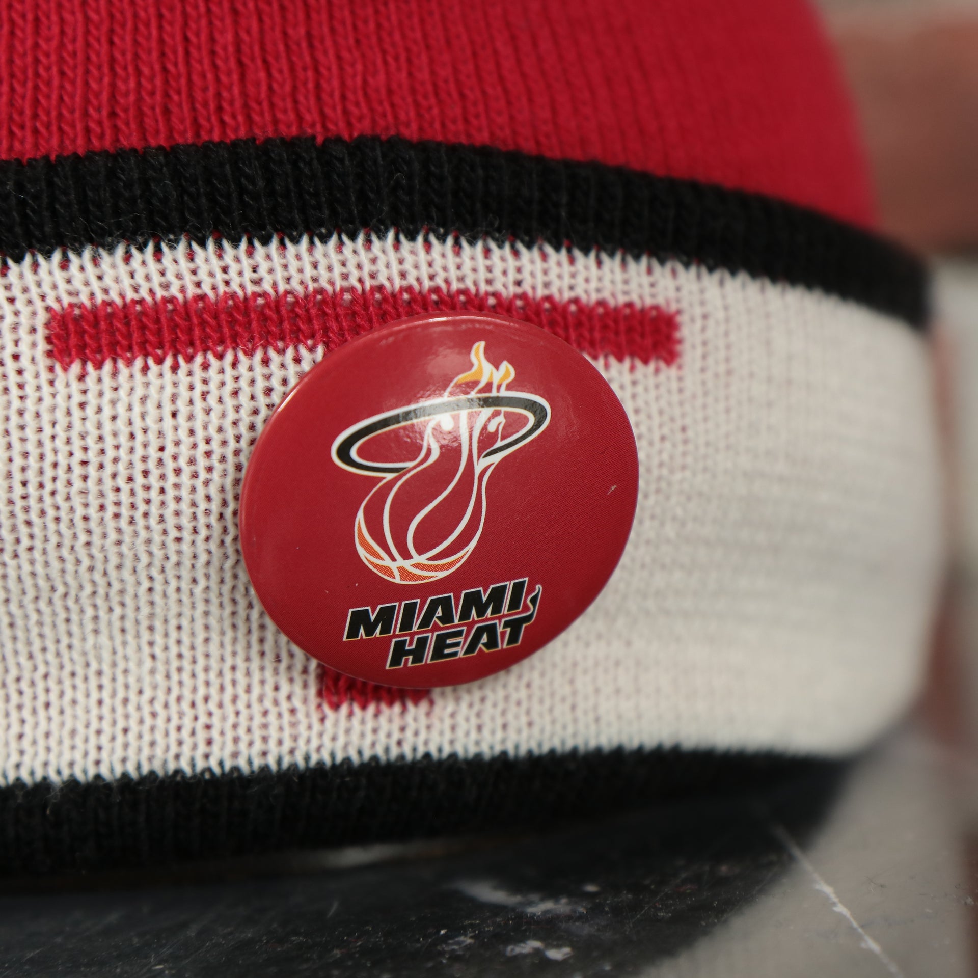 heat pin on the Miami Heat Split Pom Pom Winter Beanie With Heat Pin | Red Winter Beanie