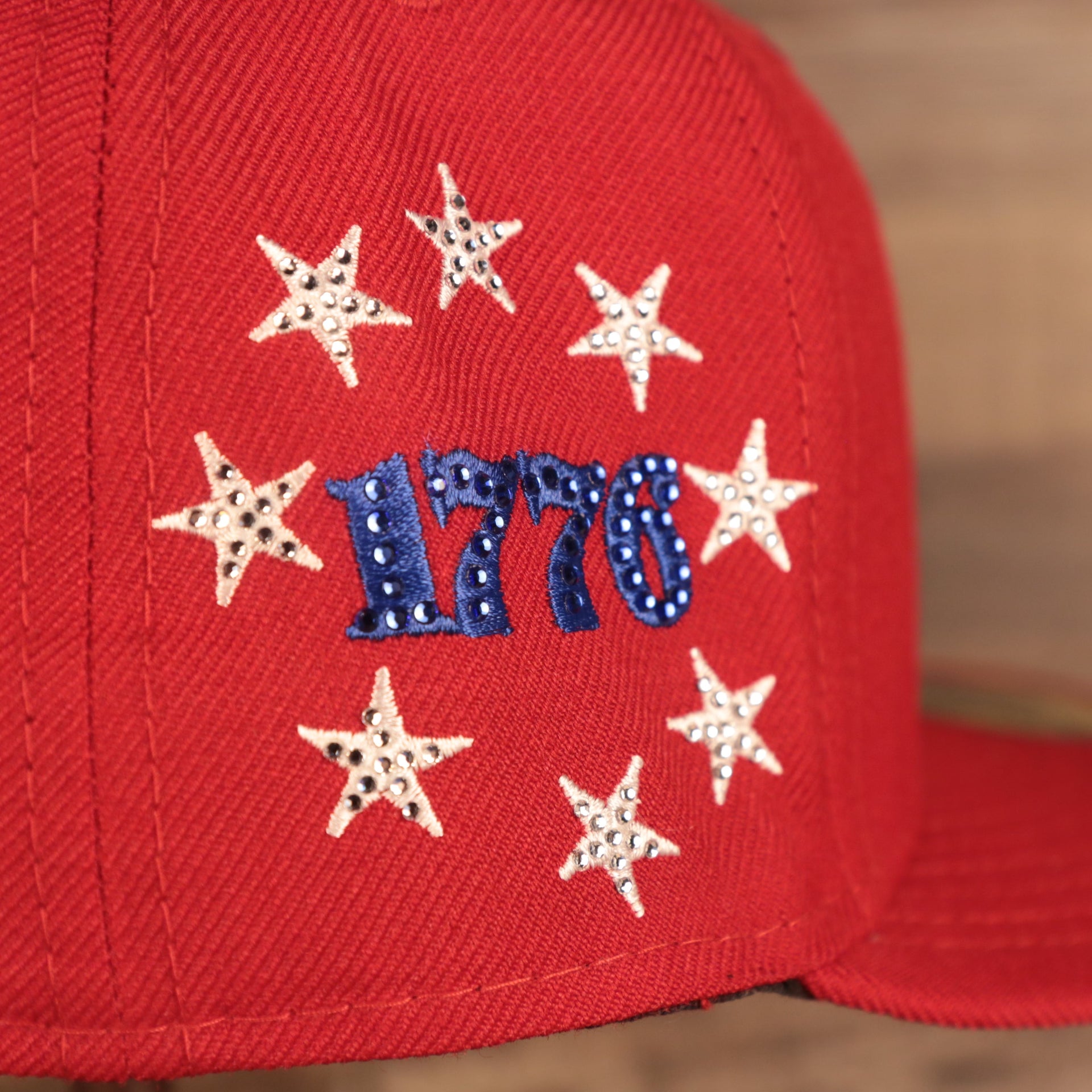 Close up of the 1776 star logo on the Philadelphia Phillies Iced Out Side Patch Bell 1776 Gray Bottom 59Fifty Fitted Cap