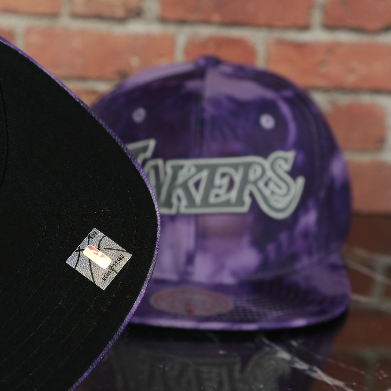 black under visor on the Los Angeles Lakers Galaxy Purple Reflective Script Mitchell and Ness Snapback Hat