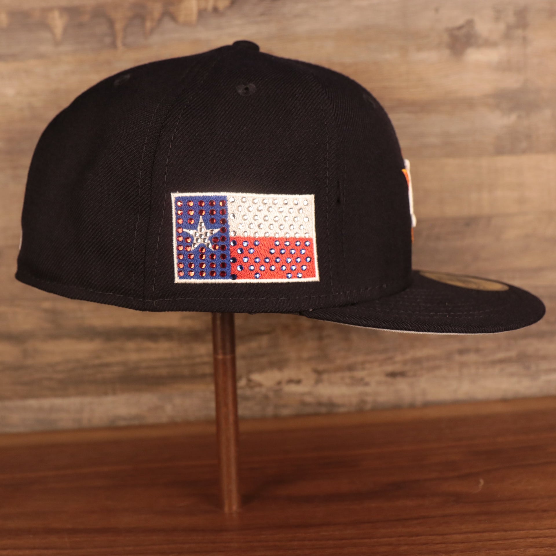 The wearer's right side of the Houston Astros Iced Out Side Patch Cactus Texas Flag Gray Bottom 59Fifty Fitted Cap