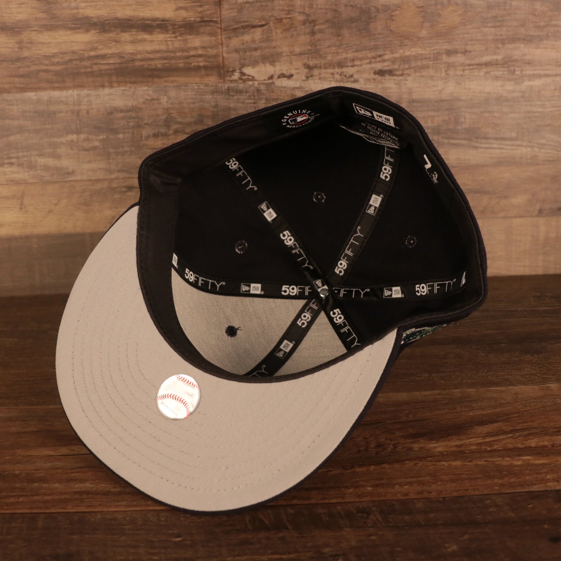 Grey under visor of the New York Yankees Iced Out Side Patch Apple Statue of Liberty Gray Bottom 59Fifty Fitted Cap