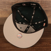 Under visor of the Oakland Athletics Iced Out Side Patch Flower Oakland Bridge Gray Bottom 59Fifty Fitted Cap