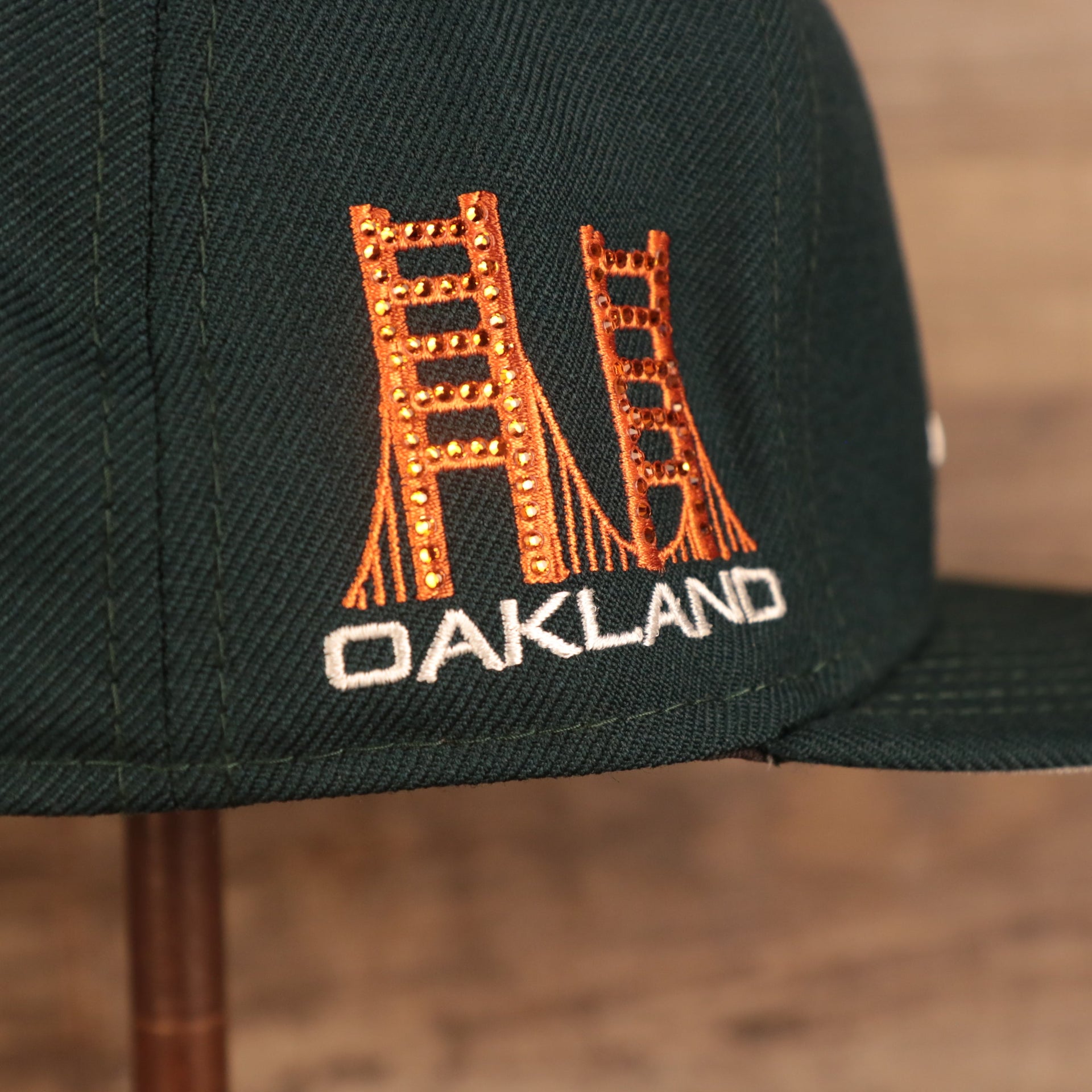 Close up of iced out Oakland Bridge on the Oakland Athletics Iced Out Side Patch Flower Oakland Bridge Gray Bottom 59Fifty Fitted Cap