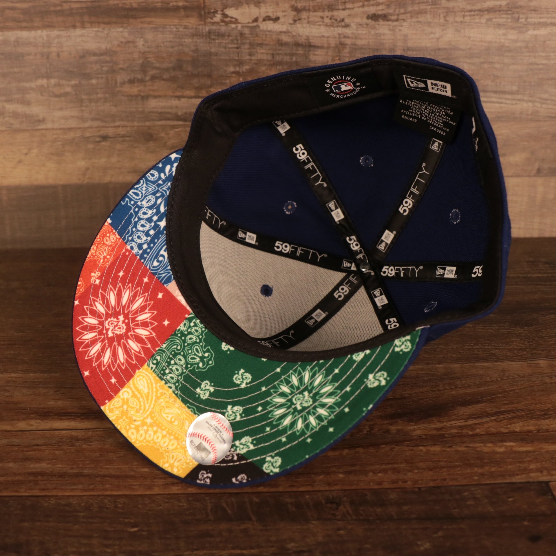 The black sweatband and black 59Fifty taping of the Los Angeles Dodger Multi-Color Paisley Bandana Under Brim 59Fifty Fitted Cap