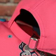 pink adjustable strap on the Lehigh Valley Ironpigs Coqui Copa De La Diversion 2023 Two-Tone Black Bottom 9Twenty Dad Hat | Pink/Blue 920