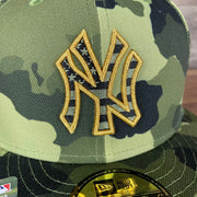 A close up of the Yankees logo on the New York Yankees 2022 Armed Forces Day / Memorial Day Side Patch 59Fifty Fitted Cap | Camo