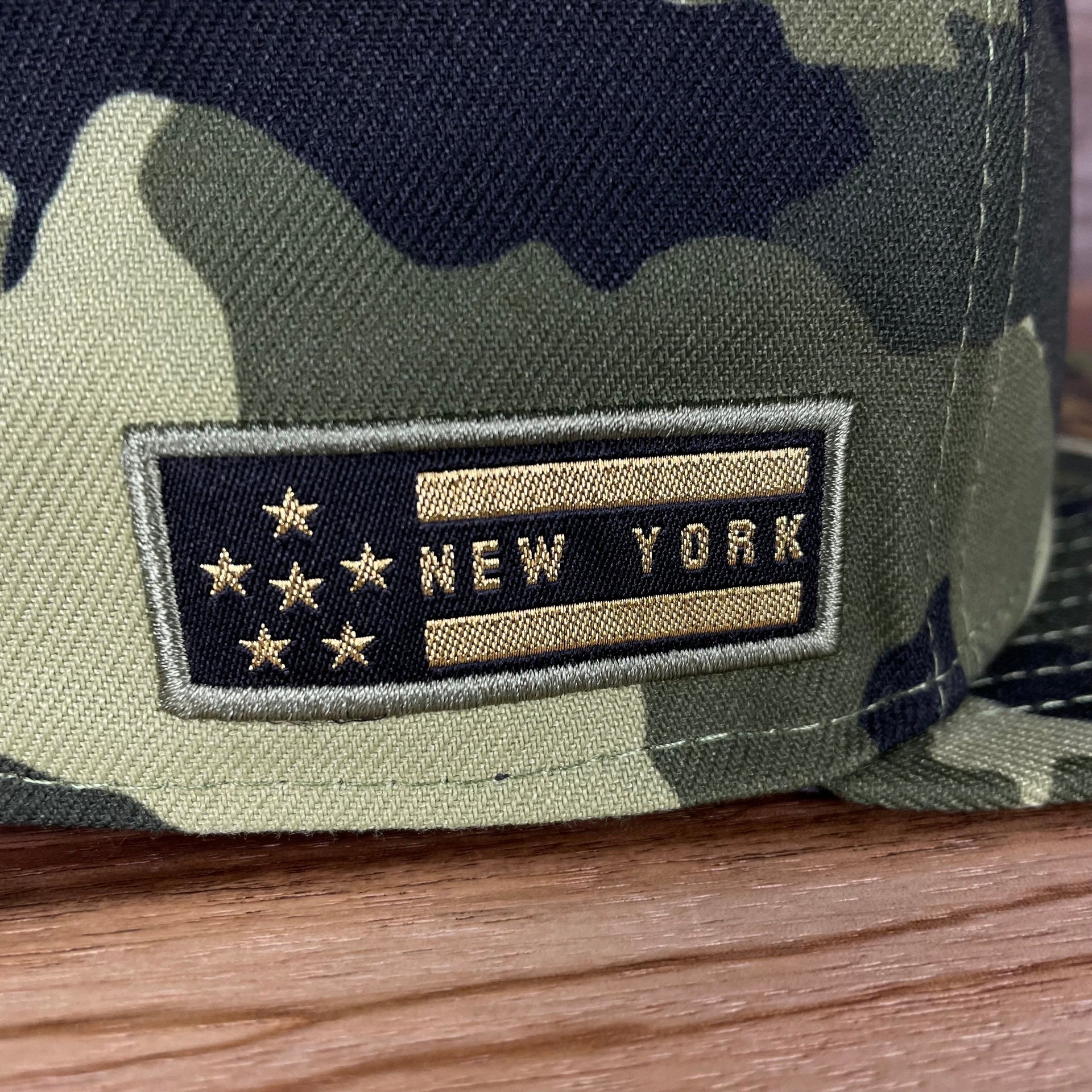 A close up of the stars and stripes side patch on the New York Mets 2022 Armed Forces Day / Memorial Day Side Patch 59Fifty Fitted Cap