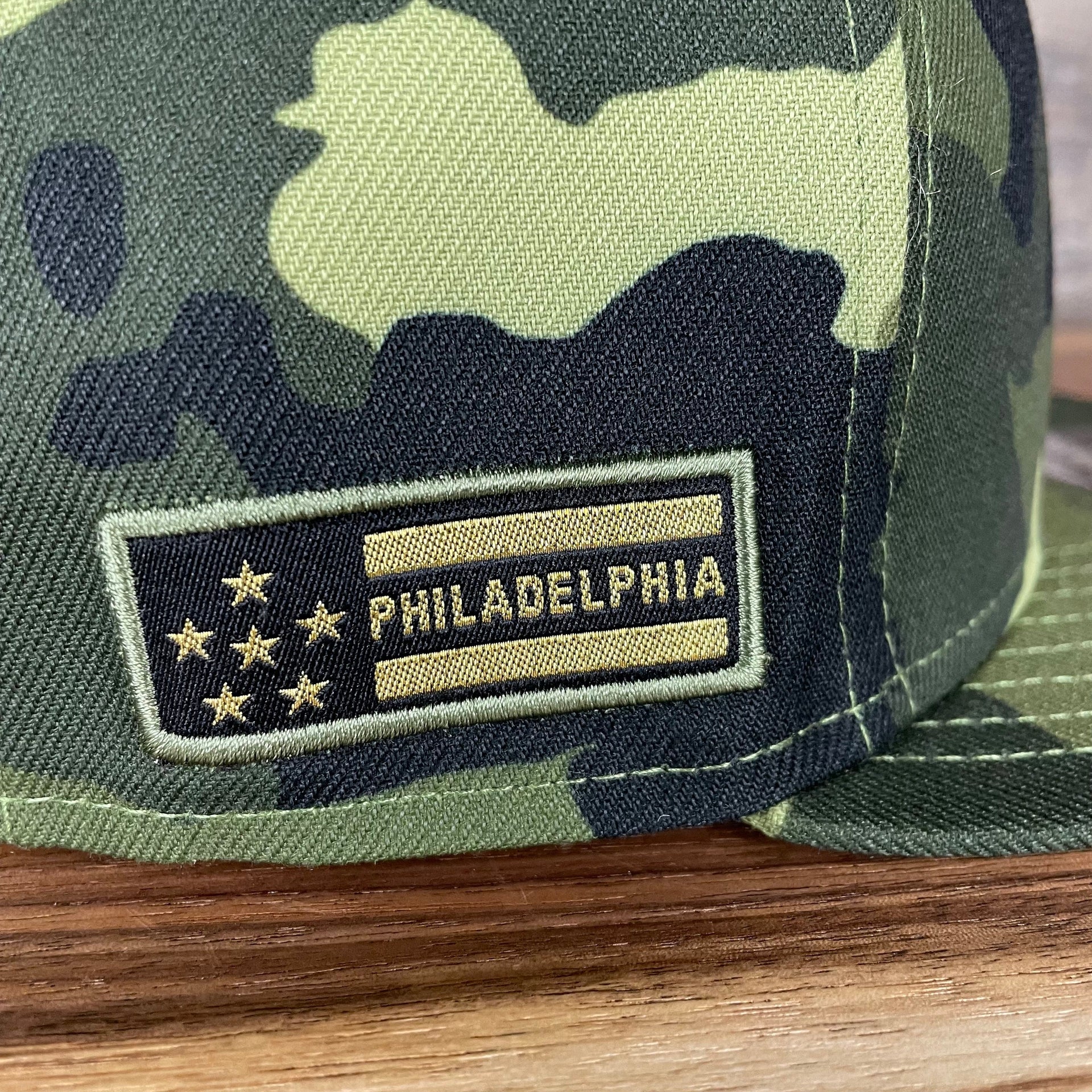 A close up of the stars and stripes side patch on the Philadelphia Phillies 2022 Armed Forces Day / Memorial Day Side Patch 9Fifty Snapback