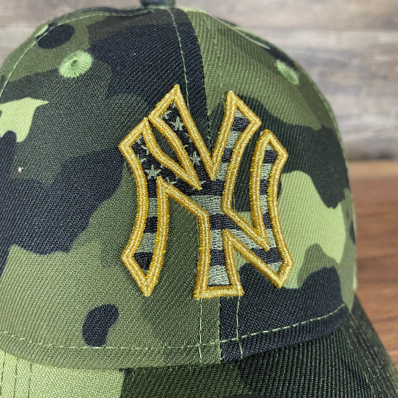 A close up of the Yankees logo on the New York Yankees 2022 Armed Forces Day / Memorial Day Side Patch 9Twenty Dad Hat