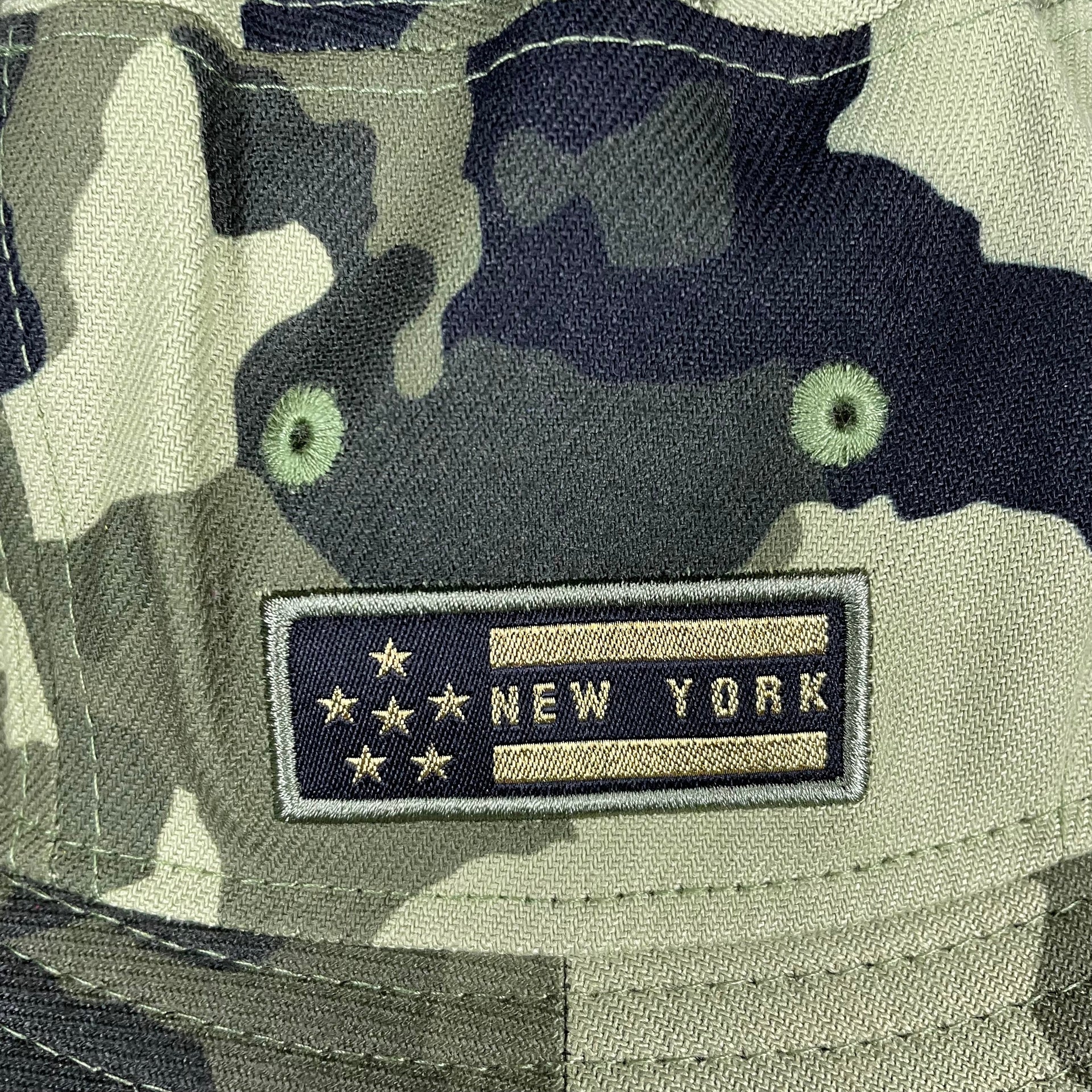 A close up of the stars and stripes side patch on the New York Yankees 2022 Armed Forces Day / Memorial Day Side Patch Boonie Bucket Hat