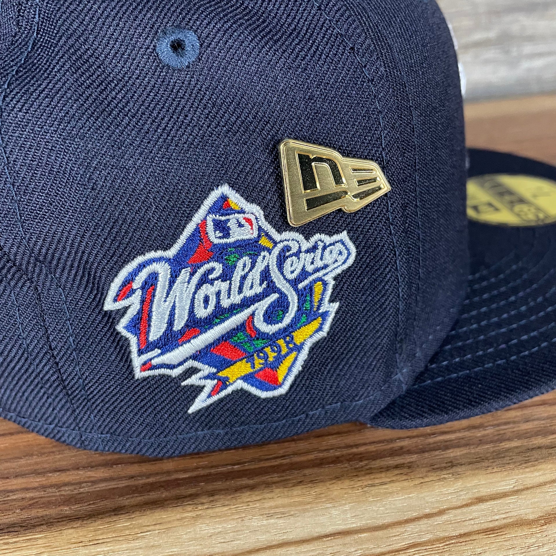 A close up of the side patch and enamel pin on the New York Yankees Cooperstown 5950 Day Side Patch Gray Bottom 59Fifty Fitted Cap