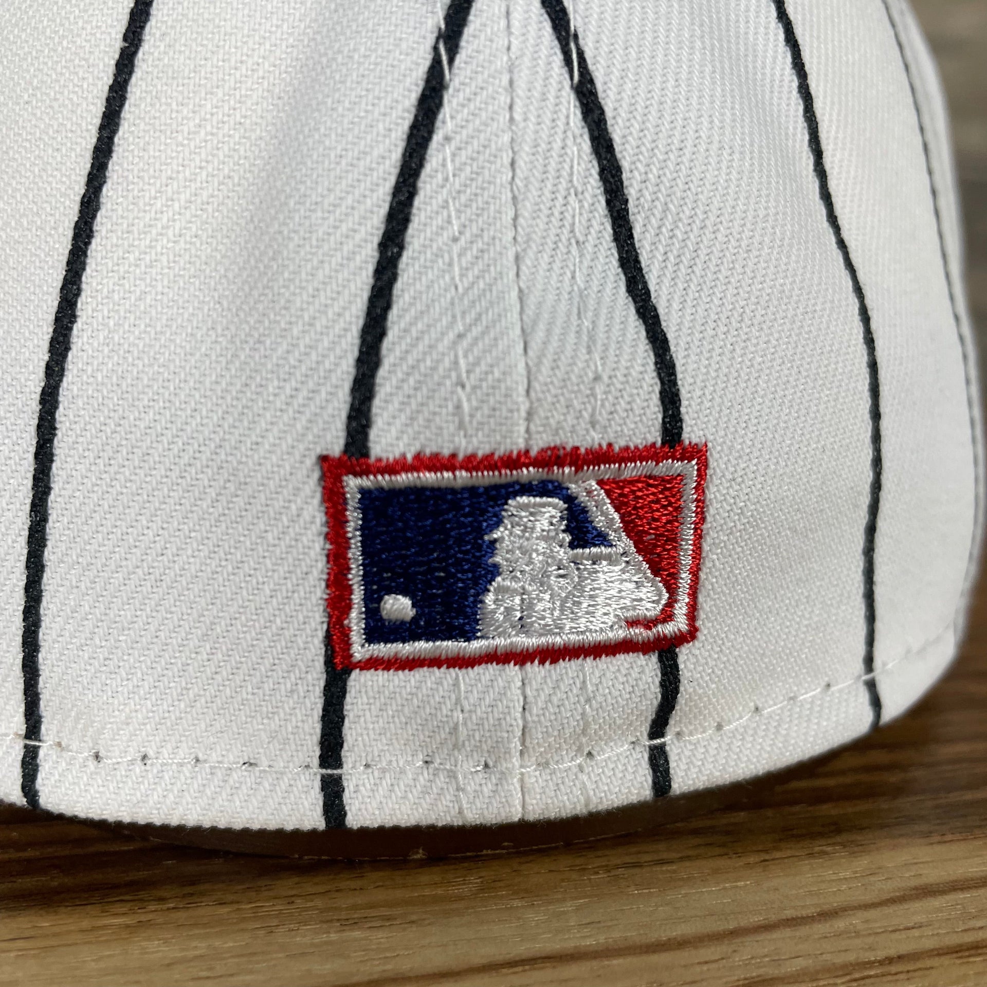 A close up of the Cooperstown MLB Batterman logo on the New York Giants Cooperstown 5950 Day Side Patch Green Bottom 59Fifty Fitted Cap